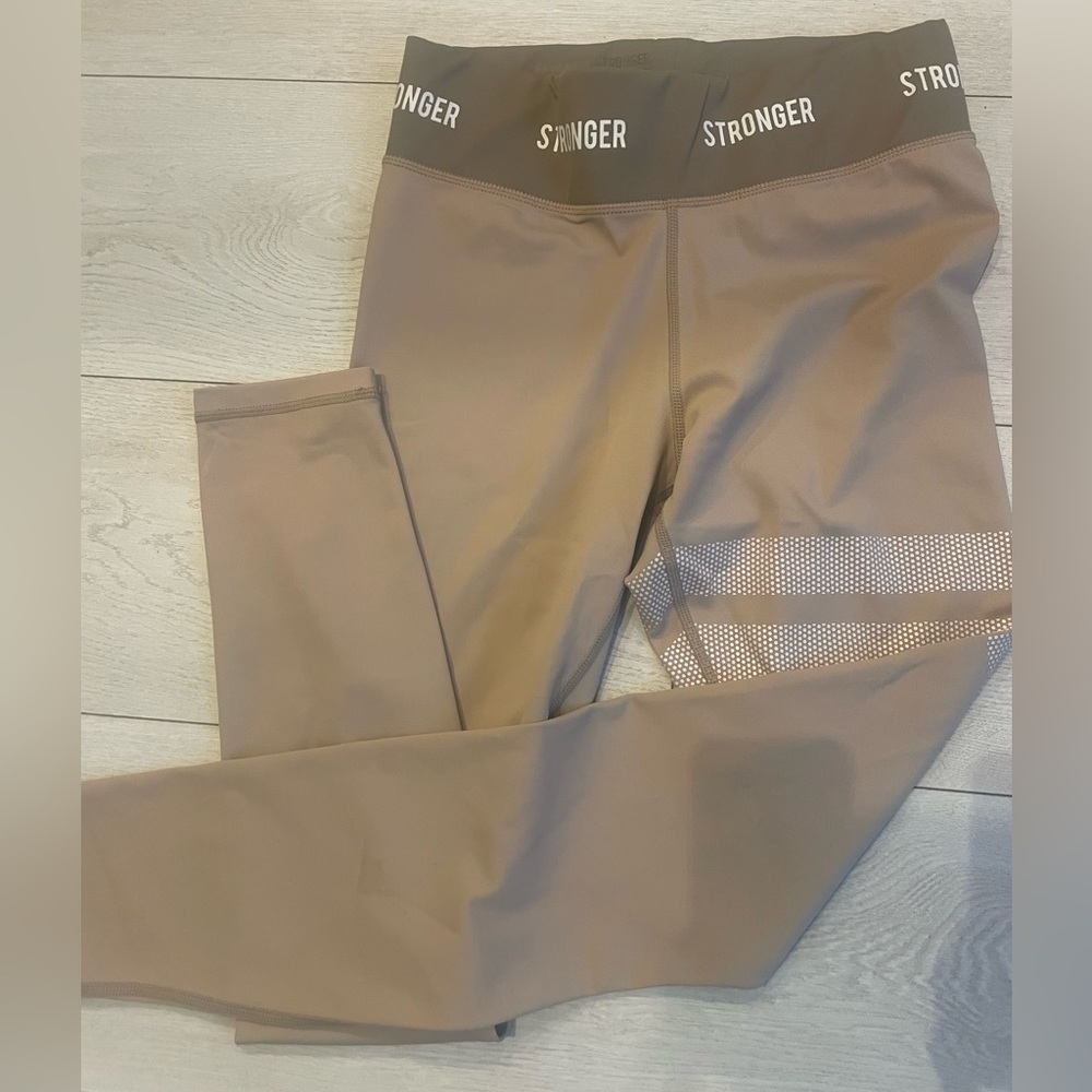 Running leggings with left thigh details, size medium.